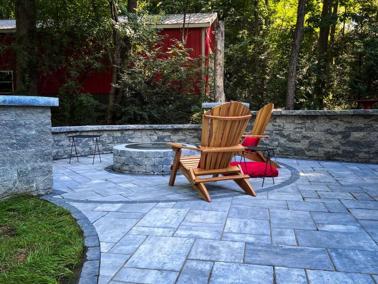 A professionally installed paver patio in Clifton Park, NY, with an outdoor dining area.