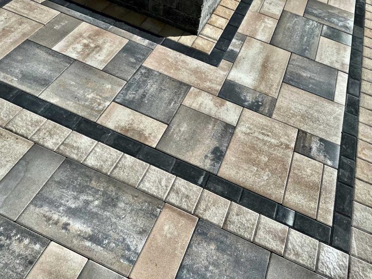pavers around a gas firepit in Malta, NY with a charcoal border.