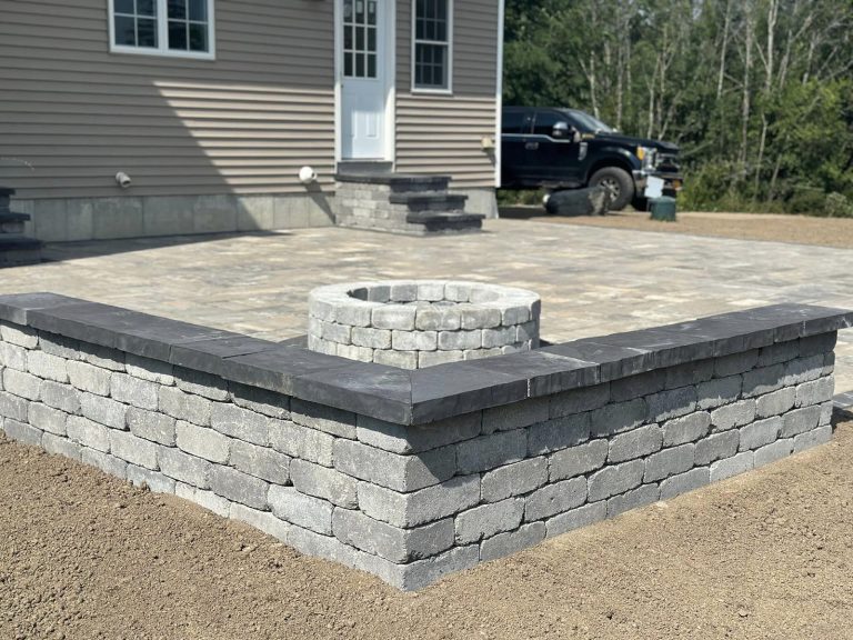 A high-end backyard patio in Halfmoon, NY, with modern outdoor furniture.